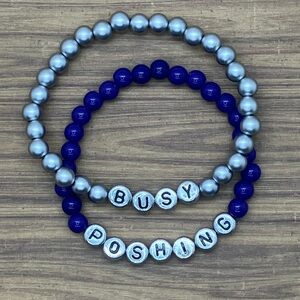Handmade stretchy beaded bracelets set that say “Busy poshing” in silver/purple
